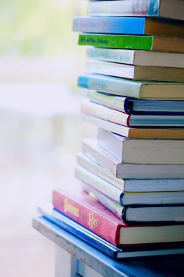 Stack of books representing published ideas and creativity